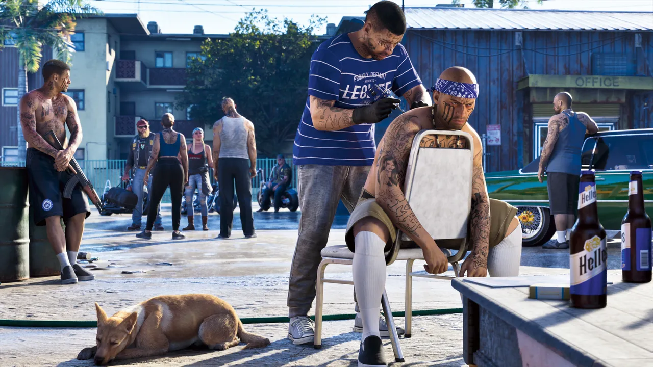 A man getting a chest tattoo outdoors while a dog sleeps nearby and others stand around with bikes